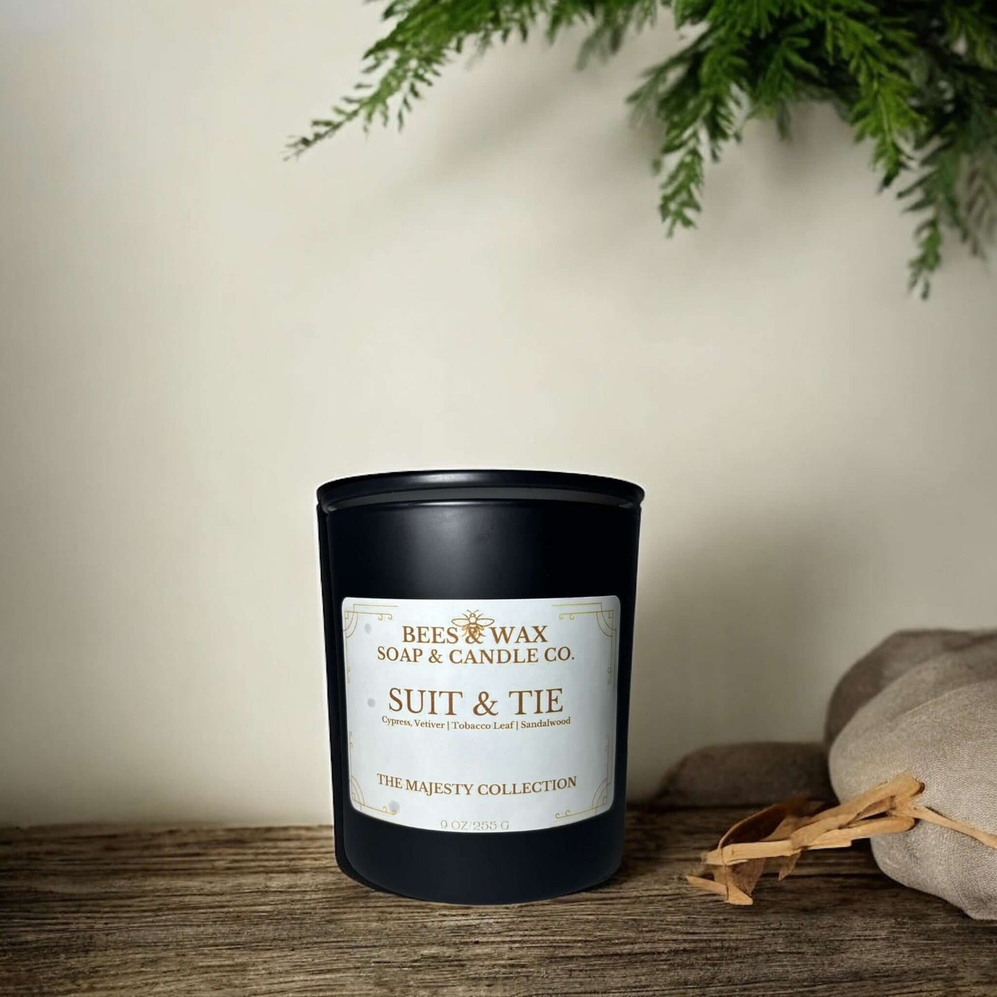 Bees & Wax Majesty Collection Suit and Tie candle in a black jar, featuring notes of creamy vanilla and smokey tobacco.